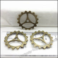 Three-Spoke Gear Metal Charms in Five Finish Options view 3