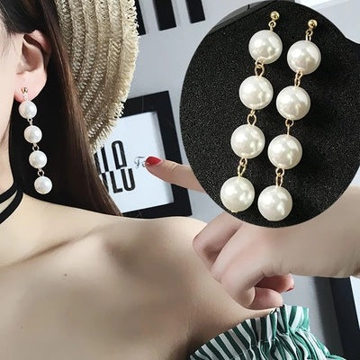 Primary supplied view of four pearl-look bead long earrings