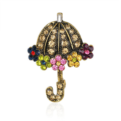 Front product view of the flower brooch pin in gold and pink
