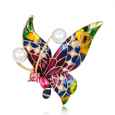 Front product view of the butterfly brooch pin in gold and red