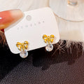 Elegant Korean Gold Plated Alloy Bowknot Pearl Drop Stud Earrings For Women Fashion Jewelry Earrings view 2