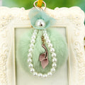 Flower Pearl Loop Plush Pom Pom Keychain in Pale Pink view 4
