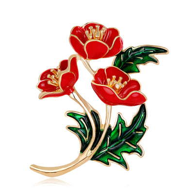 Front product view of the poppy flower brooch pin in red and gold