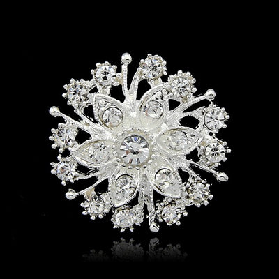 Front product view of the crystal snowburst brooch pin in black and silver