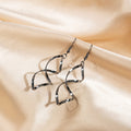 Elegant Minimalist Alloy Spiral Wave Curve Drop Stud Earrings for Women European American Style Earrings view 3
