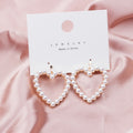 Elegant Vintage Faux Pearl Alloy Hollow Heart Drop Clip On Earrings For Women Korean Chic Geometric Earrings view 1