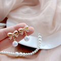 Elegant Pink Enamel Bowknot Faux Pearl Drop Clip On Alloy Korean Fashion Statement Earrings view 4
