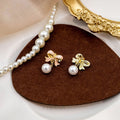 Elegant Pink Enamel Bowknot Faux Pearl Drop Clip On Alloy Korean Fashion Statement Earrings view 3