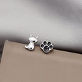 Cute Asymmetric Mini Cat And Black Enamel Paw Studs Elegant Alloy Cartoon Fresh Jewelry Earrings view 3