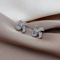 Luxury Gold Alloy Micro Paved Zircon Spinning Pinwheel Flower Stud Earrings for Women Elegant Earrings view 3