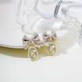 Elegant Bow Knot Oval Pearl Rhinestone Gold Alloy Stud Drop Earrings view 1