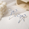 French Vintage Acrylic Bow Knot Long Tassel Asymmetric Stud Elegant Camouflage Pattern Earrings view 3