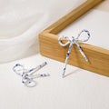 French Vintage Acrylic Bow Knot Long Tassel Asymmetric Stud Elegant Camouflage Pattern Earrings view 4