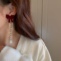 French Vintage Flocked Bow Pearl Tassel Drop Earrings With Silver Needle Convertible Stud Design view 4