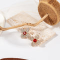 Elegant Four Petal Flower Studs With Micro Pave Rhinestones And Black Crystal Center Earrings view 3