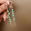 Green Cat Eye Stone Flower Silver Needle Earrings Anti Loss Ginkgo Bamboo Four Petal Ear Cuff view 4