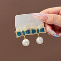 Elegant Korean Style Rhinestone Bowknot Pearl Drop Stud Earrings For Women Luxury Alloy Silver Needle Earrings view 2