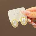 Korean Oval Pearl Rhinestone Stud Earrings Luxury Red Gemstone Statement Alloy Earrings view 3
