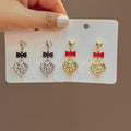 Vintage Embossed Heart Pendant Alloy Earrings With Enamel Bowknot For Women Fashion Drop Earrings view 1