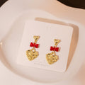 Vintage Embossed Heart Pendant Alloy Earrings With Enamel Bowknot For Women Fashion Drop Earrings view 2