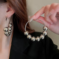 European American Alloy Hoop Earrings With Sliding Bead Geometric Circle Ball Design view 1