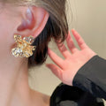 Korean Minimalist Alloy Metal Flower Stud Earrings With Geometric Floral Design view 4