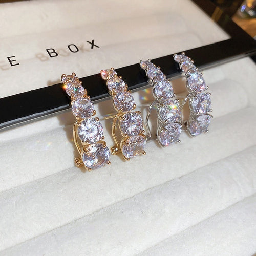 Chic Gold Plated Copper Curved Line Zircon Drop Earrings With Silver Posts For Women