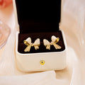 Elegant French Cream Enamel Bowknot Studs For Women Light Luxury Sweet Alloy Bow Ear Jewelry Earrings view 2