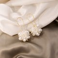 Luxury White Acrylic Flower Ball Long Drop Hook Earrings Elegant Petal Geometric Statement Earrings view 3