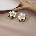 Elegant White Enamel Camellia Flower Studs With Green Leaves And Rhinestone Center Alloy Earrings view 3