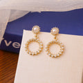 Elegant Korean Hollow Round Drop Pearl Rhinestone Micro Paved Gold Alloy Luxury Dangle Earrings view 1