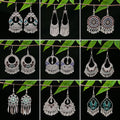 Vintage Ethnic Miao Silver Plated Alloy Earrings With Geometric Waterdrop Bell Tassel Hollow Design view 3