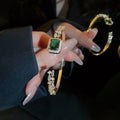 Light Luxury Copper Open Bangle With Square Emerald Green Zircon Ring Design view 2