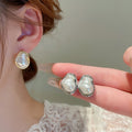 French Light Luxury Irregular Baroque Faux Pearl Stud Earrings For Women Vintage Geometric Round Design view 3