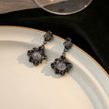 Elegant Dark Alloy Irregular Hollow Geometric Round Moonstone Drop Stud Earrings view 2