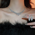 Light Luxury Alloy Rhinestone Teardrop U Shape Tassel Necklace And Drop Earrings Jewelry Set view 1