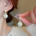 Gold Plated Copper Oval Pearl Zircon Stud Earrings With Silver Posts Minimalist Geometric Style view 1