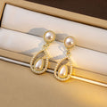 Vintage French Pearl Teardrop Dangle Earrings Luxury Alloy Rhinestone Hollow Water Drop Elegant Stud Earrings view 2