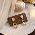 Vintage French Pearl Teardrop Dangle Earrings Luxury Alloy Rhinestone Hollow Water Drop Elegant Stud Earrings view 1