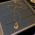 French Vintage Light Luxury Stainless Steel Faux Tiger Eye Teardrop Sweater Necklace view 4