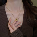 French Vintage Light Luxury Stainless Steel Faux Tiger Eye Teardrop Sweater Necklace view 1
