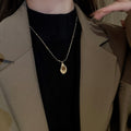 French Vintage Light Luxury Stainless Steel Faux Tiger Eye Teardrop Sweater Necklace view 3