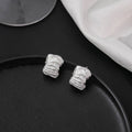 Light Luxury Brushed Alloy C-Shaped Chunky Hoop Earrings For Women Minimalist Textured Metal Stud Earrings view 3