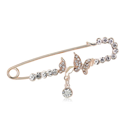 Front product view of the butterfly brooch pin in silver and gold