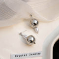Elegant Silver Alloy Irregular Geometric Round Ball And Baroque Pearl Asymmetric Drop Stud Earrings view 2