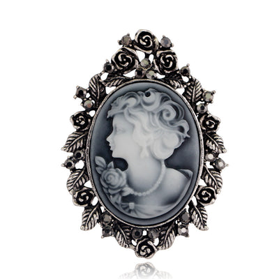 Front product view of the woman portrait brooch pin in silver and black
