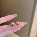 Gold Plated Metal Oval Stud Earrings With Silver Posts Minimalist Modern Commuter Jewelry view 3