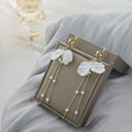 Elegant Korean White Shell Petal Pearl Alloy Chain Tassel Long Drop Clip-On Women's Earrings view 3