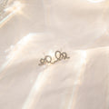 Elegant Korean Rhinestone Cream Swirl Cross Hollow Studs Silver Needle Commuter Versatile Earrings view 3