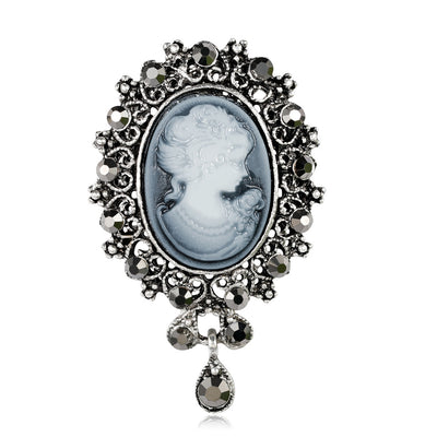 Front product view of the woman portrait brooch pin in silver and blue